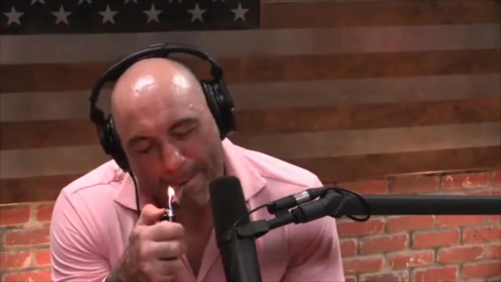 Joe Rogan smoking weed during a podcast.